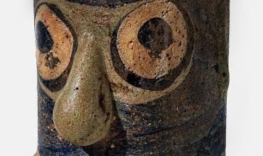Glass bead with face