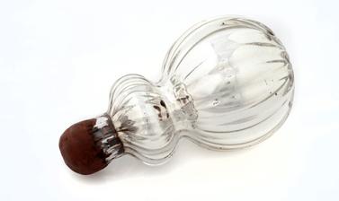 Small silver bottle with a wax stopper.
